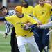 Former Michigan football Aaron Richards runs the ball past the bench during the annual alumni flag football game before spring practice at Michigan Stadium on Saturday, April 13, 2013. Melanie Maxwell I AnnArbor.com